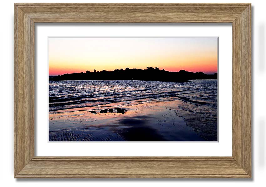 A beautifully framed print titled 'Along The Coast', showcasing serene coastal scenery, available in various frame colours.