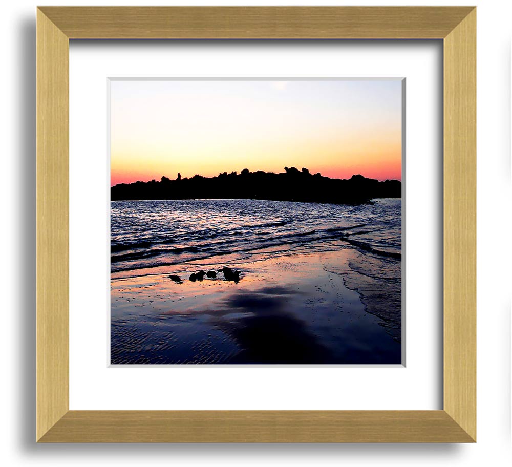 A beautifully framed square print depicting a serene coastal landscape, handmade in the UK, available in various frame colors.