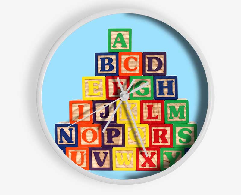 Set of baby blue alphabet blocks arranged playfully, showcasing letters and numbers for educational fun.