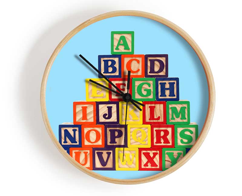 Set of baby blue alphabet blocks arranged playfully, showcasing letters and numbers for educational fun.