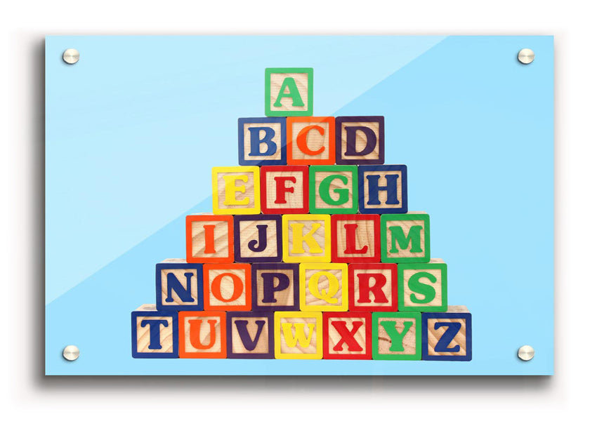 Alphabet Blocks Baby Blue acrylic print featuring colorful letters on a soothing blue background, perfect for nursery decor.