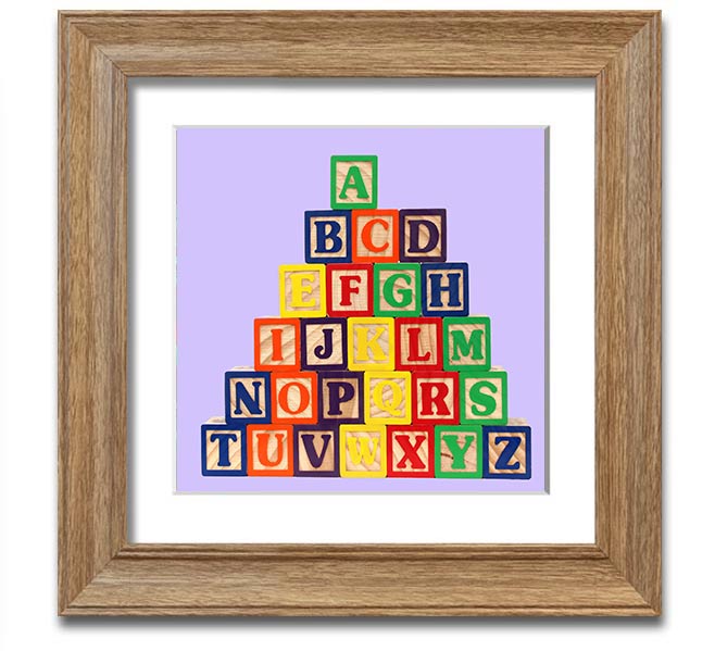 Lilac framed print featuring colorful alphabet blocks, perfect for nursery decor.