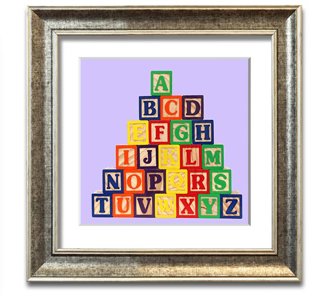 Lilac framed print featuring colorful alphabet blocks, perfect for nursery decor.