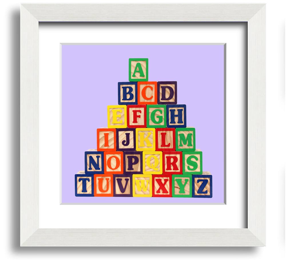 Lilac framed print featuring colorful alphabet blocks, perfect for nursery decor.