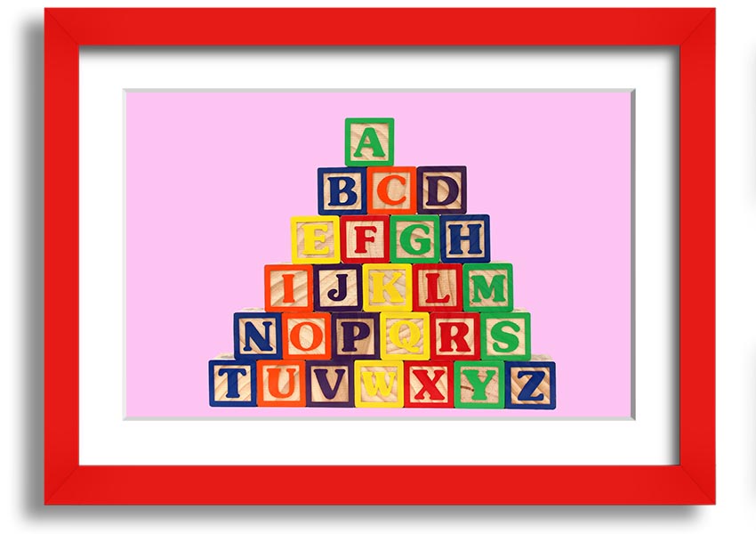 A charming pink framed print featuring colorful alphabet blocks, perfect for nursery decor.