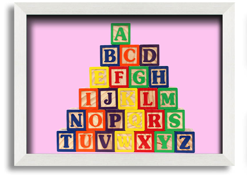 A charming pink framed print featuring colorful alphabet blocks, perfect for nursery decor.