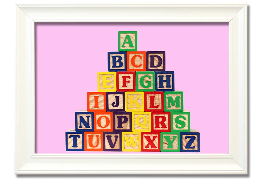 A charming pink framed print featuring colorful alphabet blocks, perfect for nursery decor.