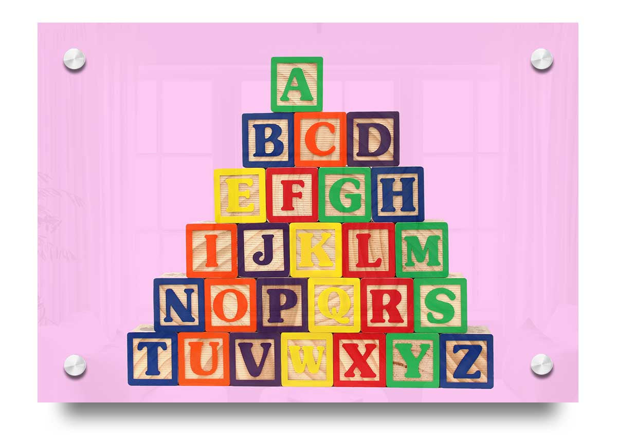 A vibrant pink acrylic print featuring colorful alphabet blocks, perfect for children's decor.