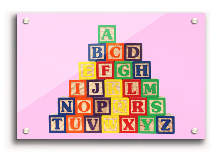 A vibrant pink acrylic print featuring colorful alphabet blocks, perfect for children's decor.