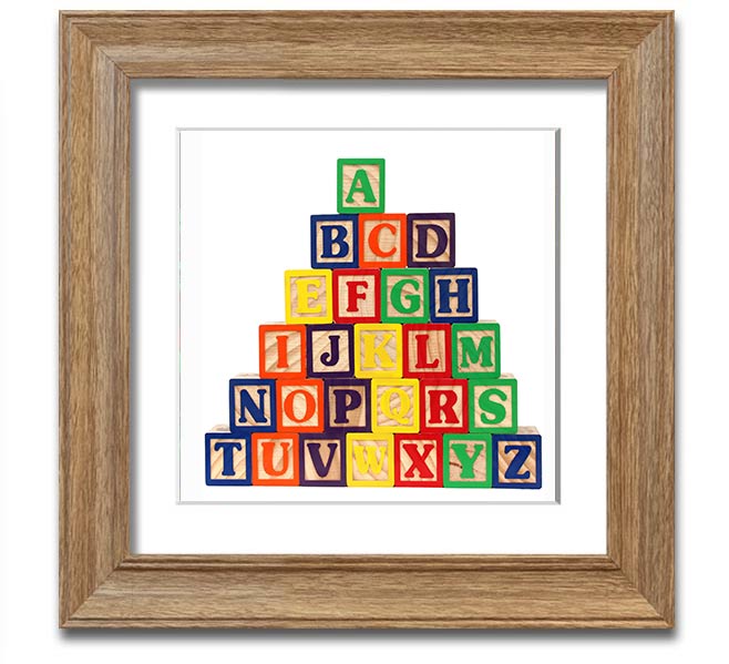 A stylish white framed print featuring colorful alphabet blocks, perfect for children's decor.