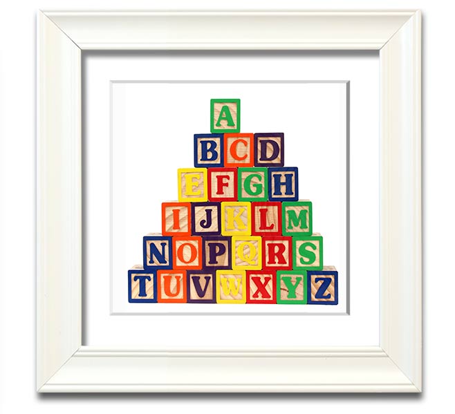 A stylish white framed print featuring colorful alphabet blocks, perfect for children's decor.