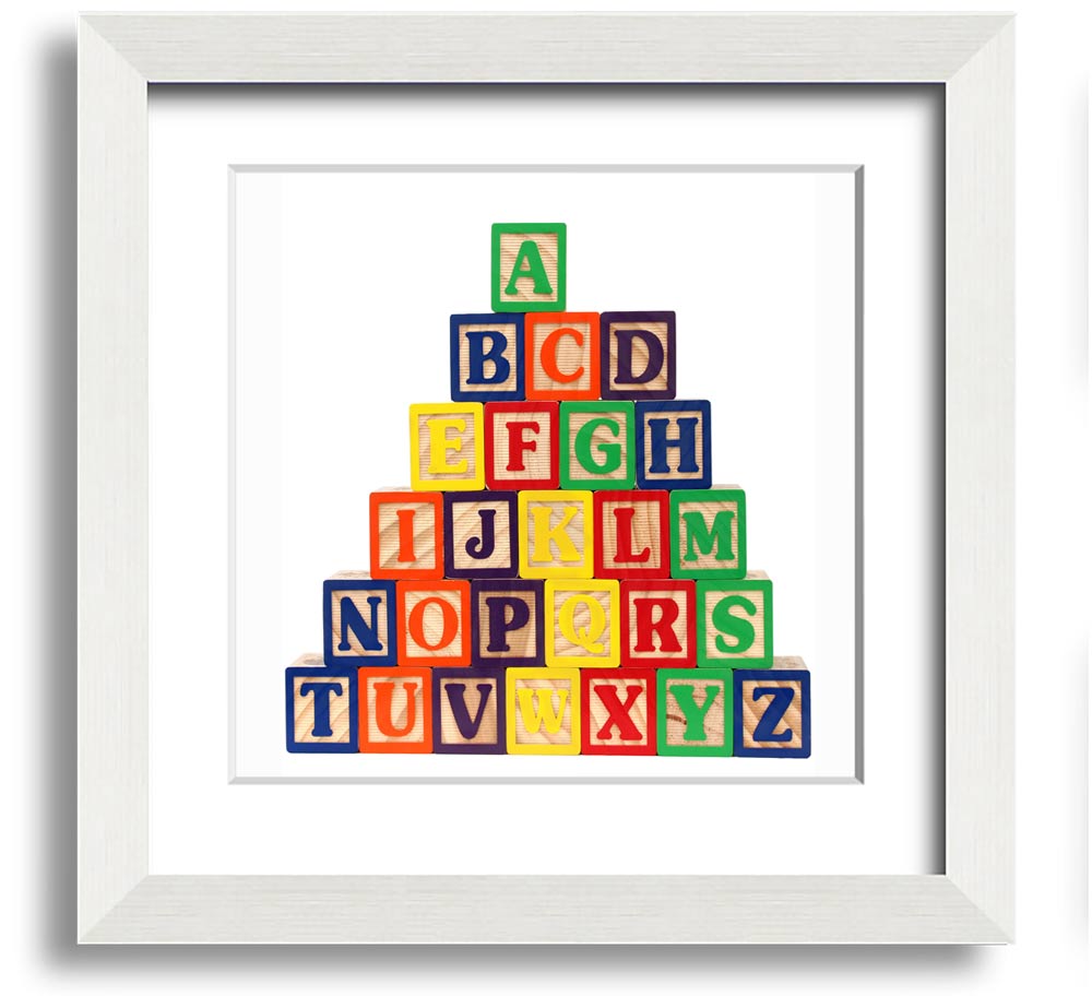 A stylish white framed print featuring colorful alphabet blocks, perfect for children's decor.