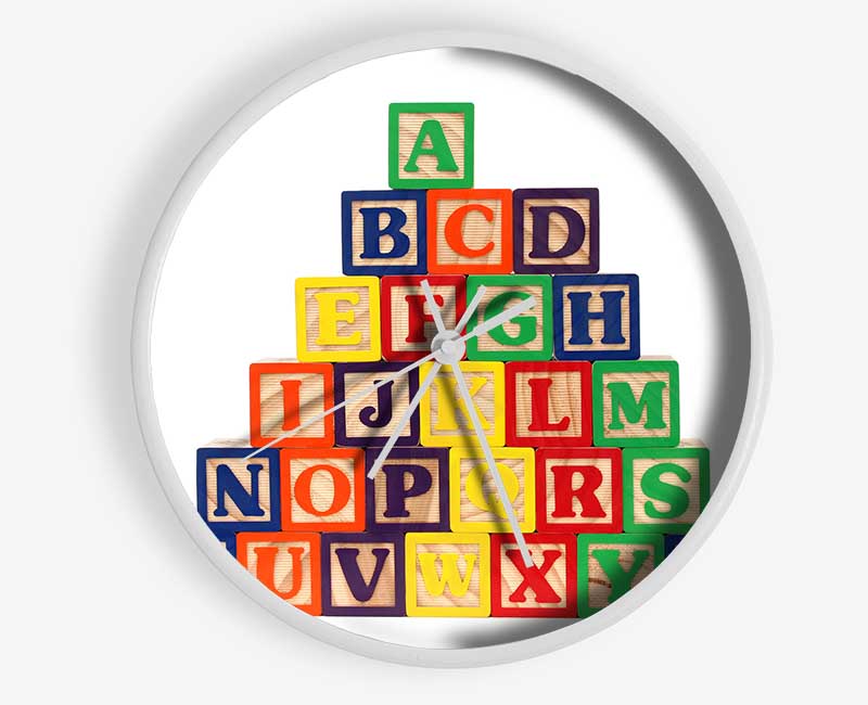 White Alphabet Blocks arranged creatively on a shelf, showcasing their modern design and educational potential.