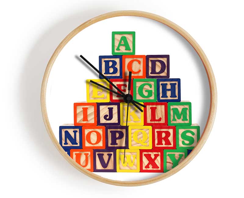 White Alphabet Blocks arranged creatively on a shelf, showcasing their modern design and educational potential.