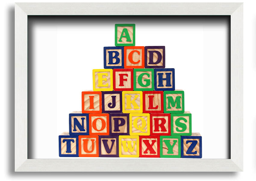 A beautifully framed print of white alphabet blocks, showcasing letters in a playful design, perfect for nursery decor.