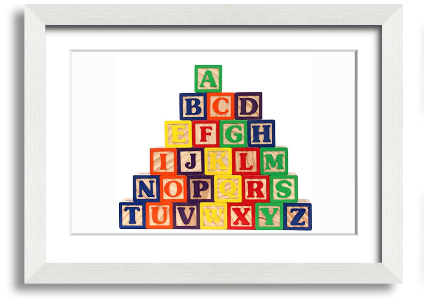 A beautifully framed print of white alphabet blocks, showcasing letters in a playful design, perfect for nursery decor.