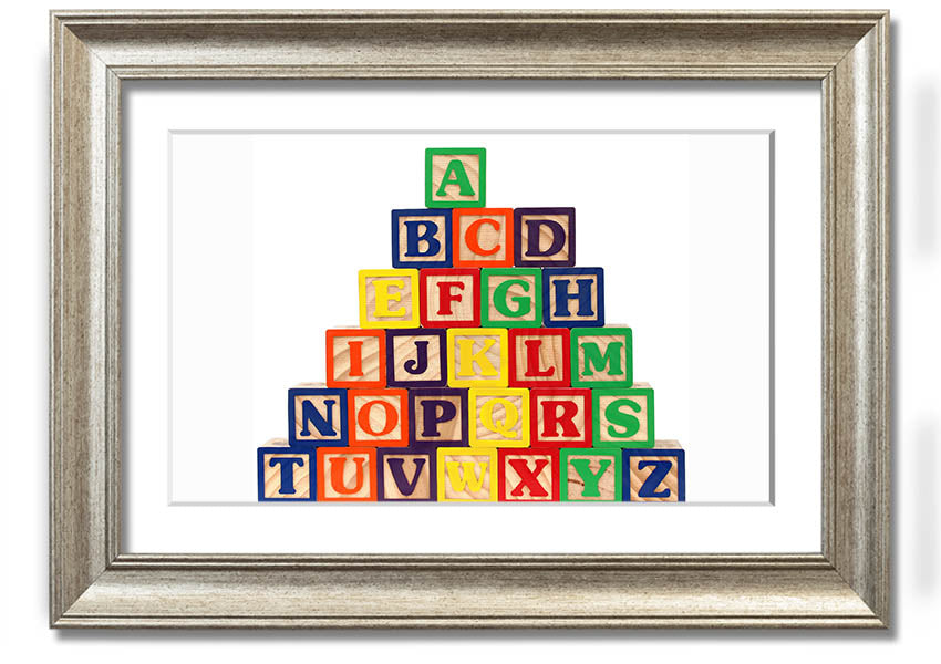 A beautifully framed print of white alphabet blocks, showcasing letters in a playful design, perfect for nursery decor.