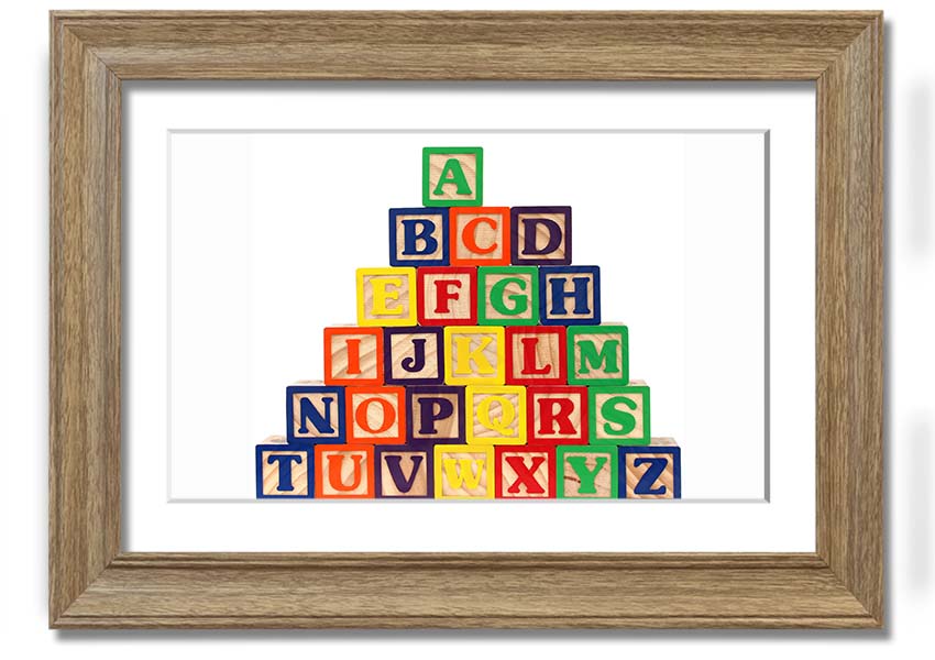 A beautifully framed print of white alphabet blocks, showcasing letters in a playful design, perfect for nursery decor.