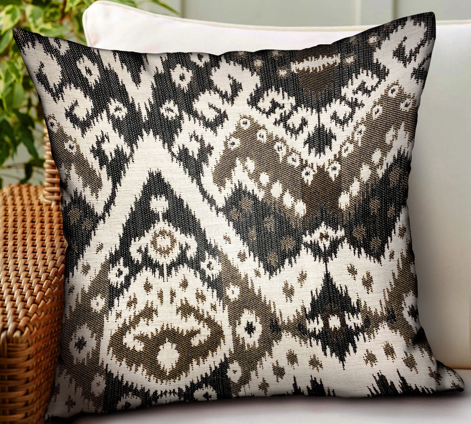 Amare Dream Brown Ikat Luxury Outdoor/Indoor Throw Pillow featuring a stylish Ikat pattern, durable Sunbrella fabric, and a hidden zipper.