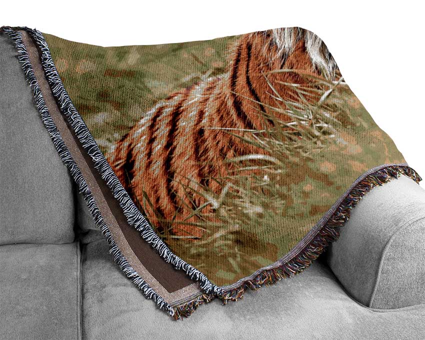 A luxurious Amazing Siberian Tiger throw blanket made from 100% cotton, featuring a thermal weave for breathability, draped elegantly on a couch.