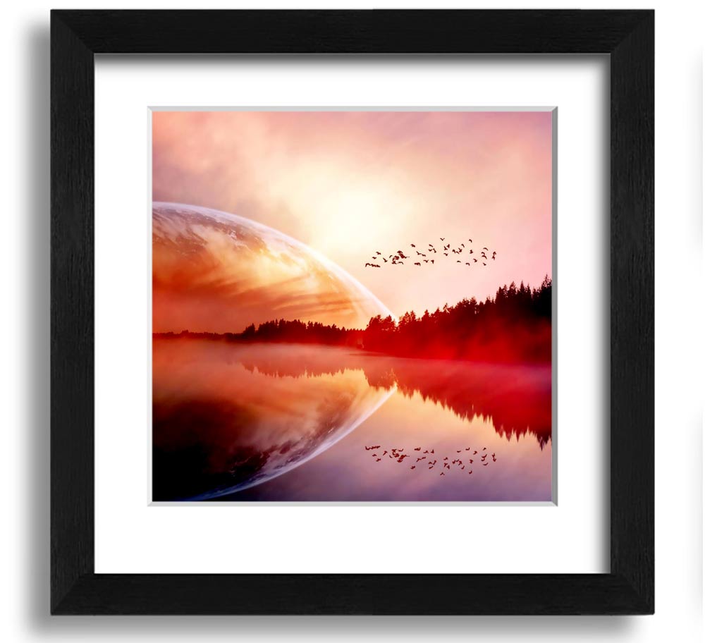 A beautifully framed print of a serene sunrise over a tranquil lake, showcasing vibrant colors and a peaceful atmosphere.