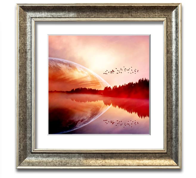 A beautifully framed print of a serene sunrise over a tranquil lake, showcasing vibrant colors and a peaceful atmosphere.