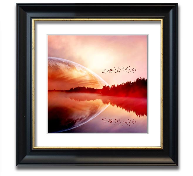 A beautifully framed print of a serene sunrise over a tranquil lake, showcasing vibrant colors and a peaceful atmosphere.