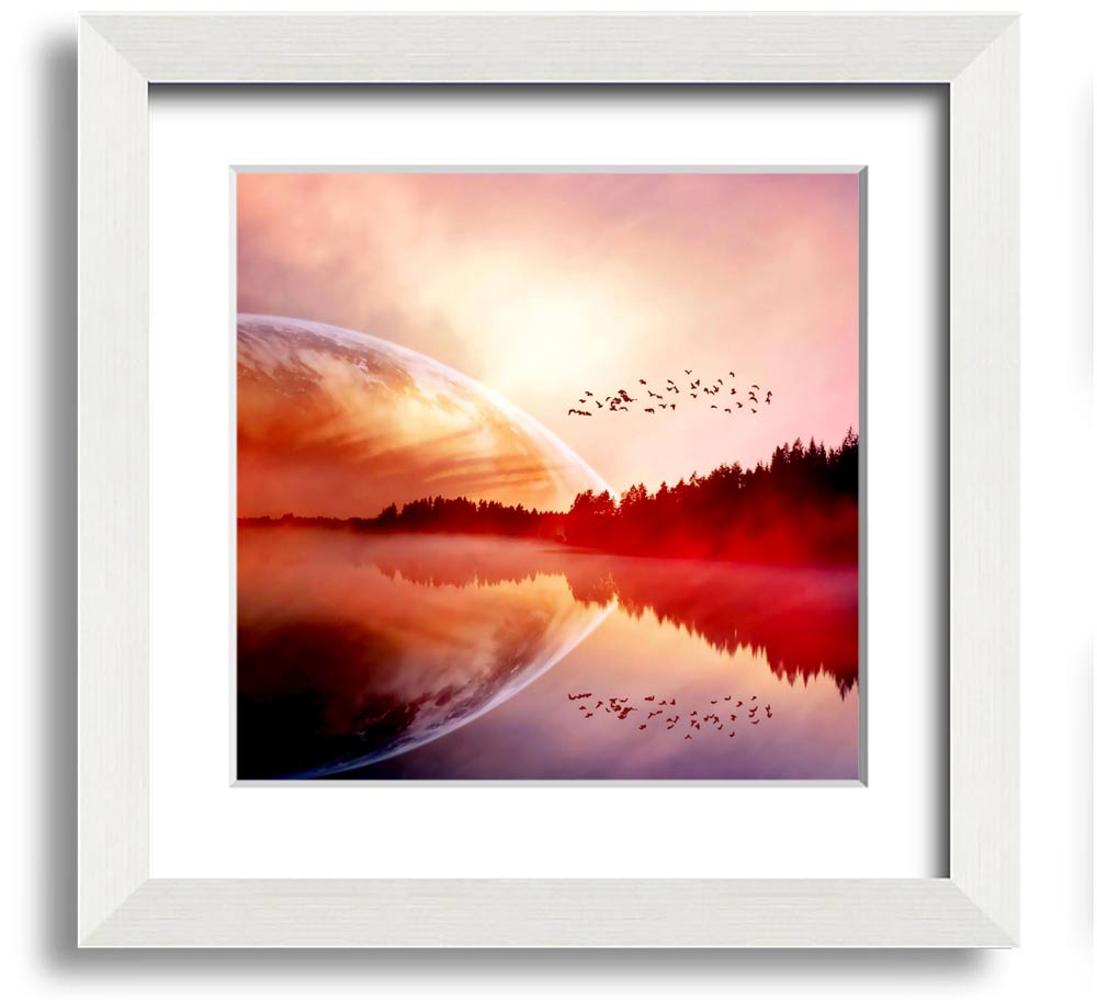 A beautifully framed print of a serene sunrise over a tranquil lake, showcasing vibrant colors and a peaceful atmosphere.