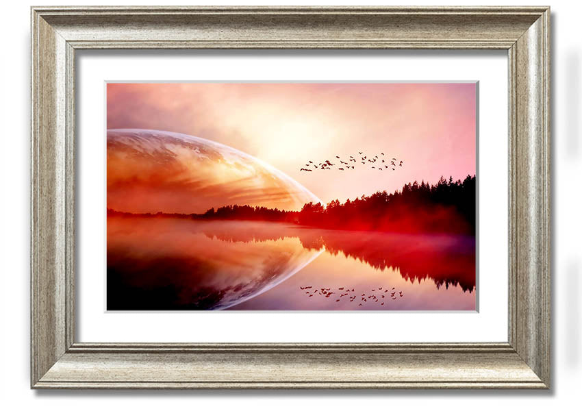 A beautifully framed print of a serene sunrise over a tranquil lake, showcasing vibrant colors and a peaceful landscape.