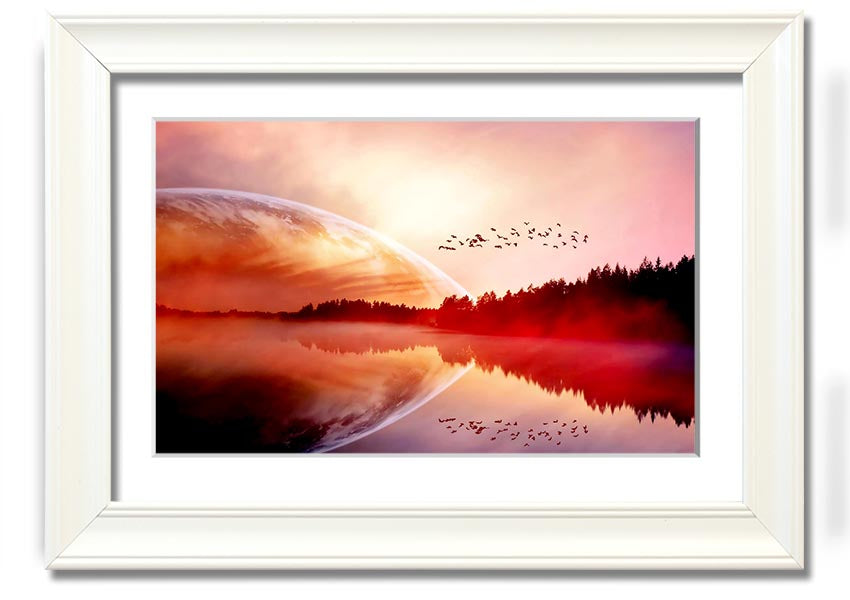 A beautifully framed print of a serene sunrise over a tranquil lake, showcasing vibrant colors and a peaceful landscape.