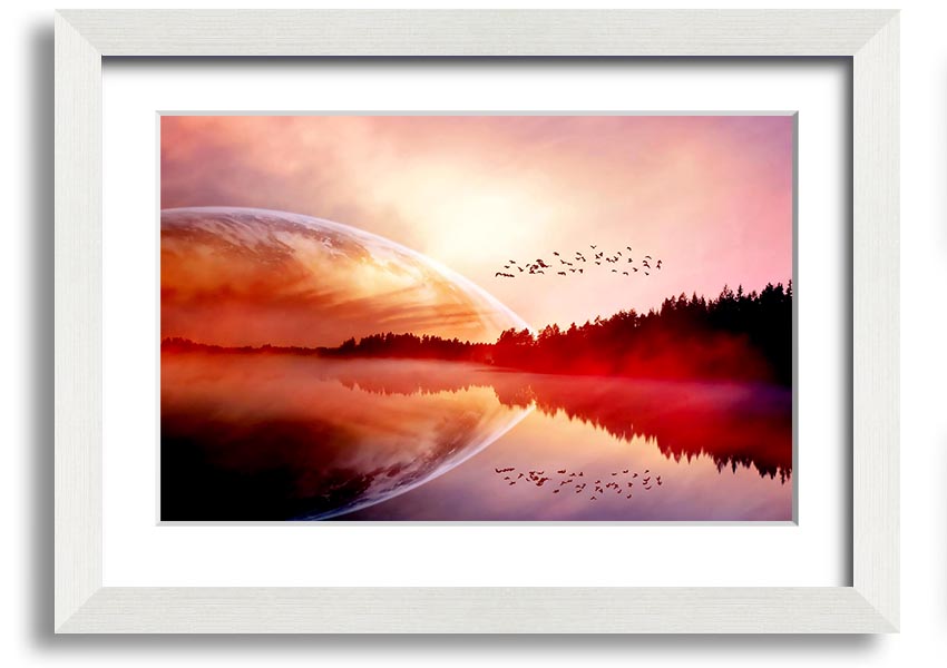 A beautifully framed print of a serene sunrise over a tranquil lake, showcasing vibrant colors and a peaceful landscape.