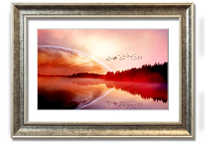 A beautifully framed print of a serene sunrise over a tranquil lake, showcasing vibrant colors and a peaceful landscape.