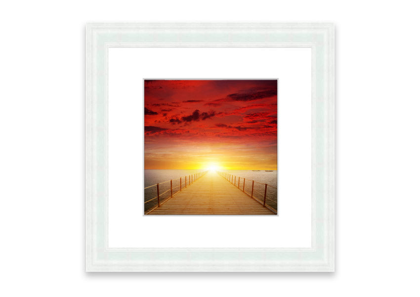 Framed print of a sunset over a boardwalk, showcasing vibrant colors and serene scenery, available in multiple frame options.