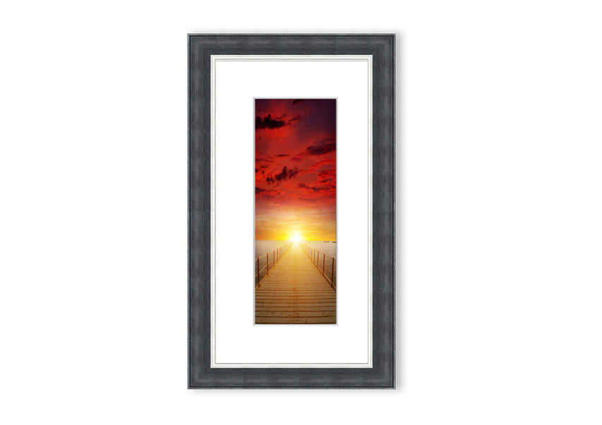 Framed print of a sunset over a boardwalk, showcasing vibrant colors and serene scenery, available in multiple frame options.