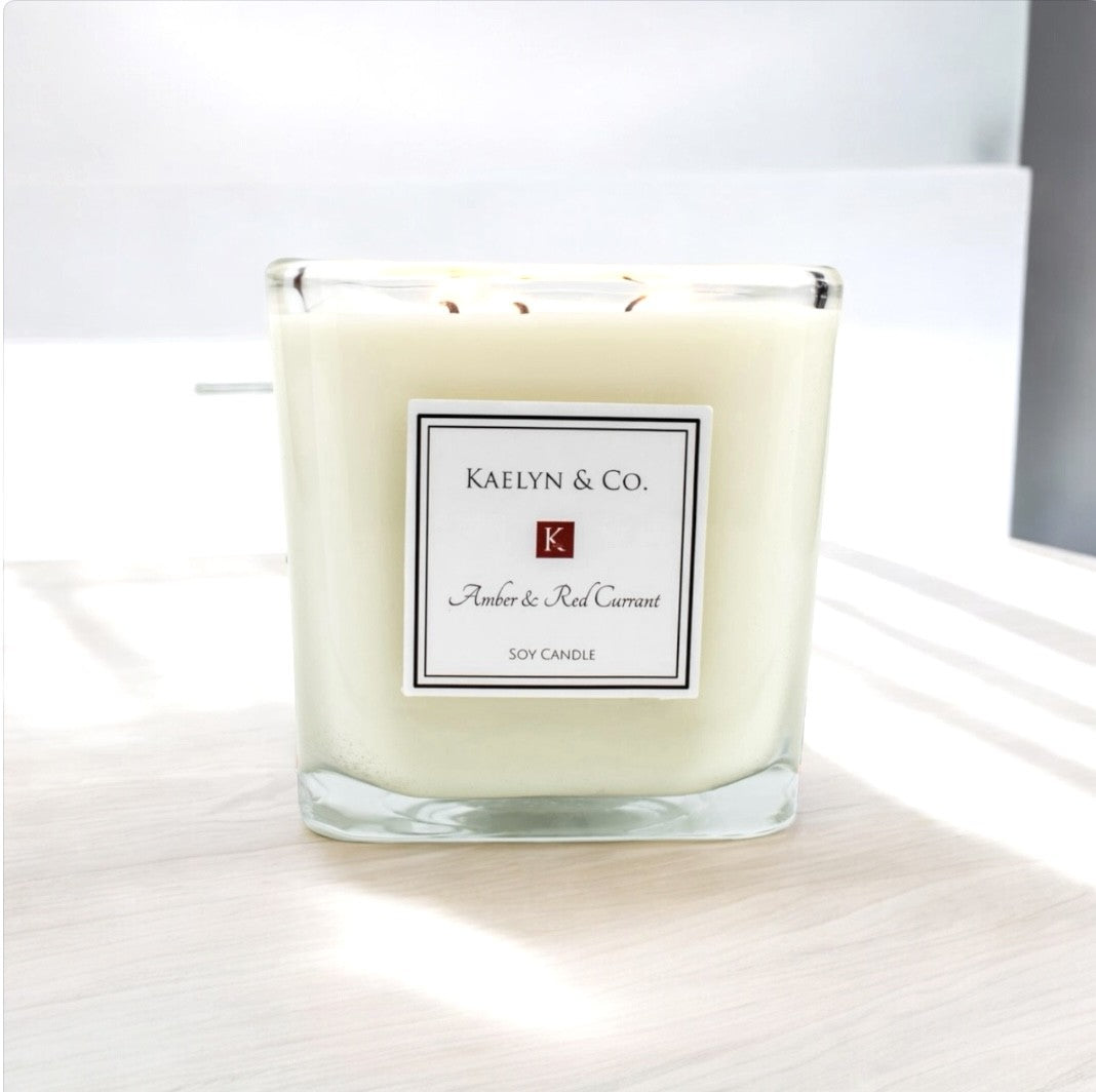 Amber & Red Currant Large Cube Candle in a stylish cube shape, showcasing its elegant design and vibrant colors.