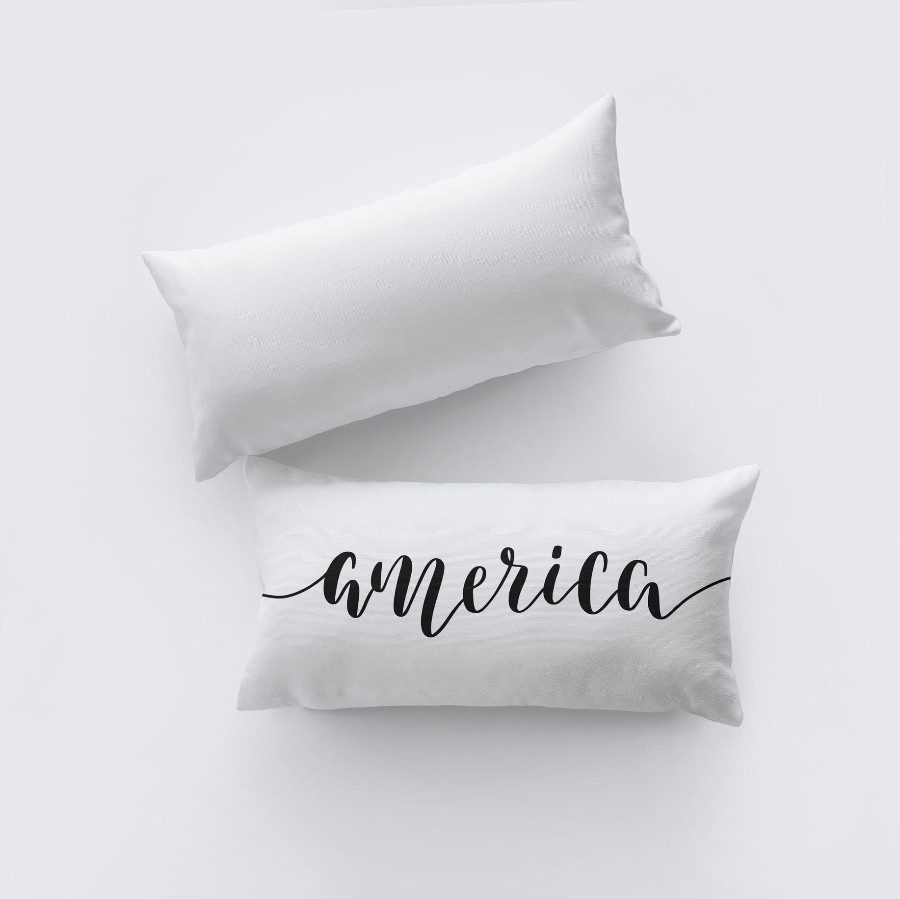 Hand-made America Pillow Cover featuring the word 'America' on the front, measuring 20x10 inches, made from a durable cotton/polyester blend.