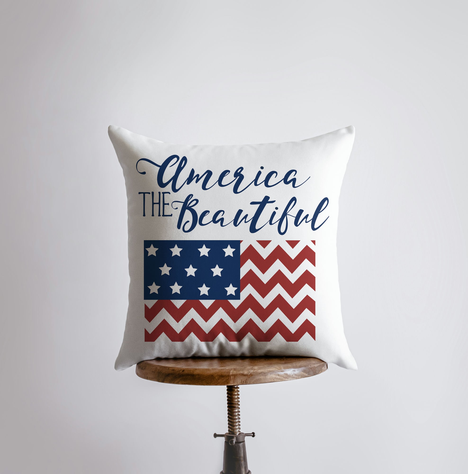 America the Beautiful pillow cover featuring 'God Bless America' design with red stripes on the back, handmade in America.