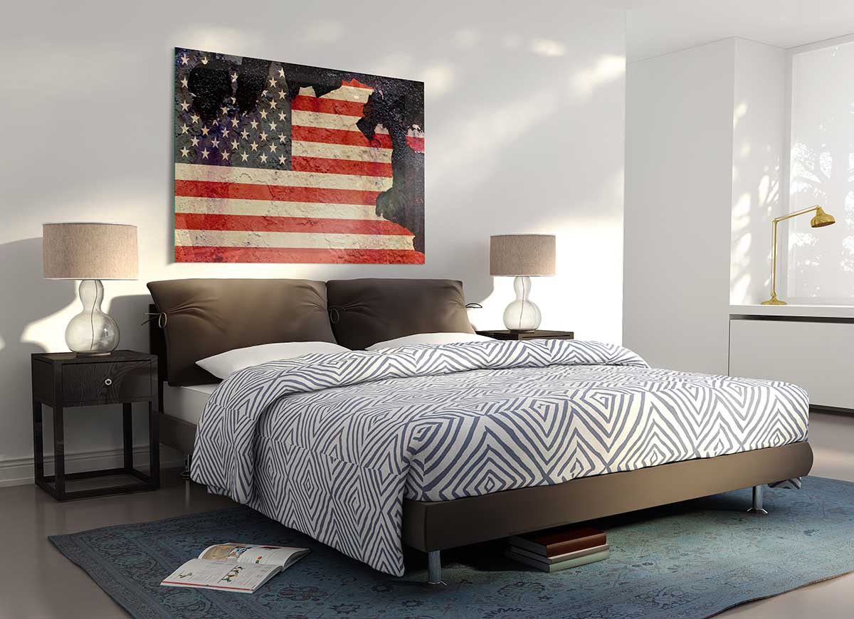 A modern glass print featuring a creatively cracked design of the American flag, showcasing vibrant colors and unique artistry.