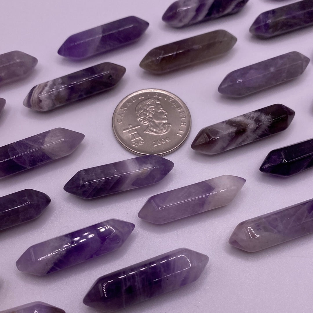 A small double terminated Amethyst crystal point showcasing rich purple hues, perfect for meditation and energy work.