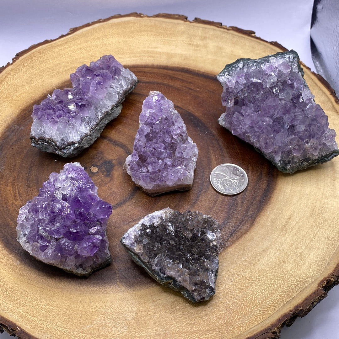 A beautiful Amethyst Druzy Cluster showcasing sparkling purple crystals, radiating positive energy and light.