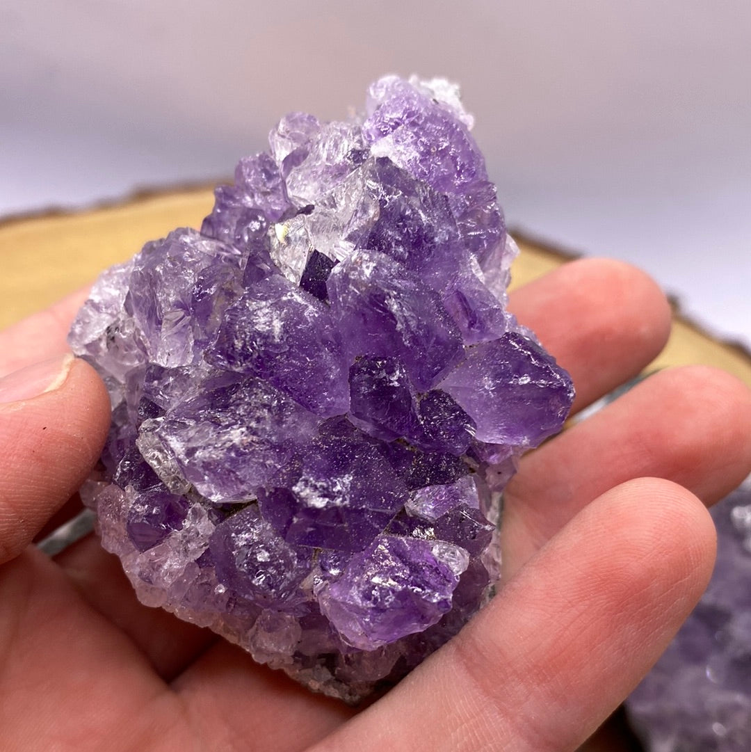 A beautiful Amethyst Druzy Cluster showcasing sparkling purple crystals, radiating positive energy and light.