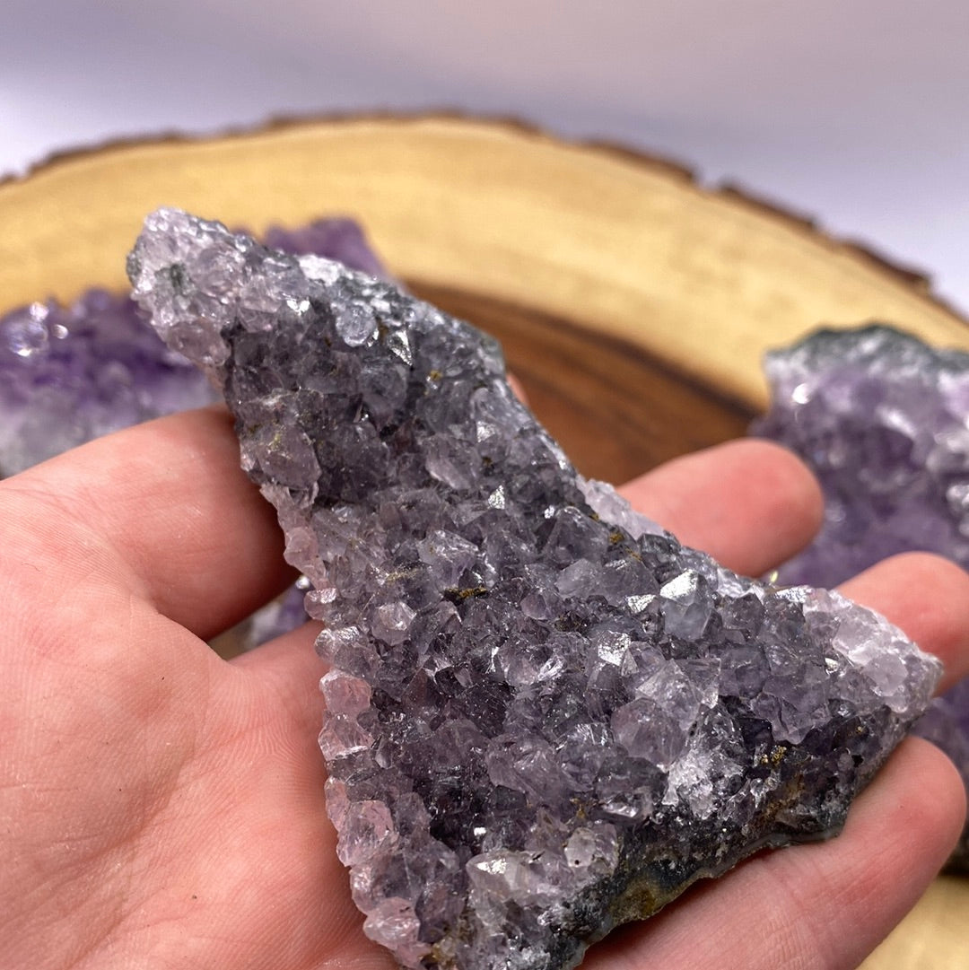 A beautiful Amethyst Druzy Cluster showcasing sparkling purple crystals, radiating positive energy and light.