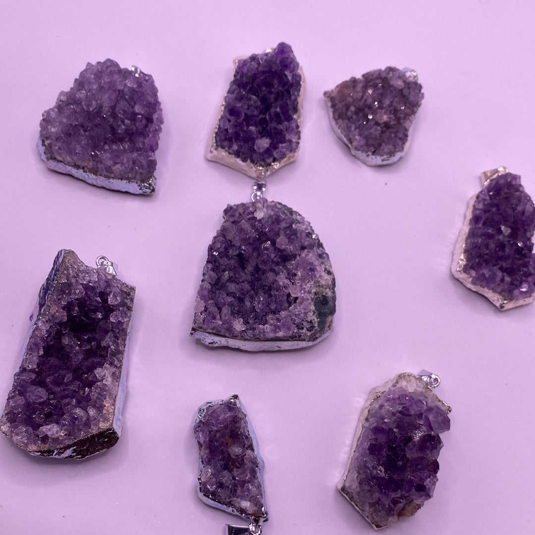 Amethyst Druzy Electroplated Pendant showcasing its vibrant purple hues and unique crystalline texture.