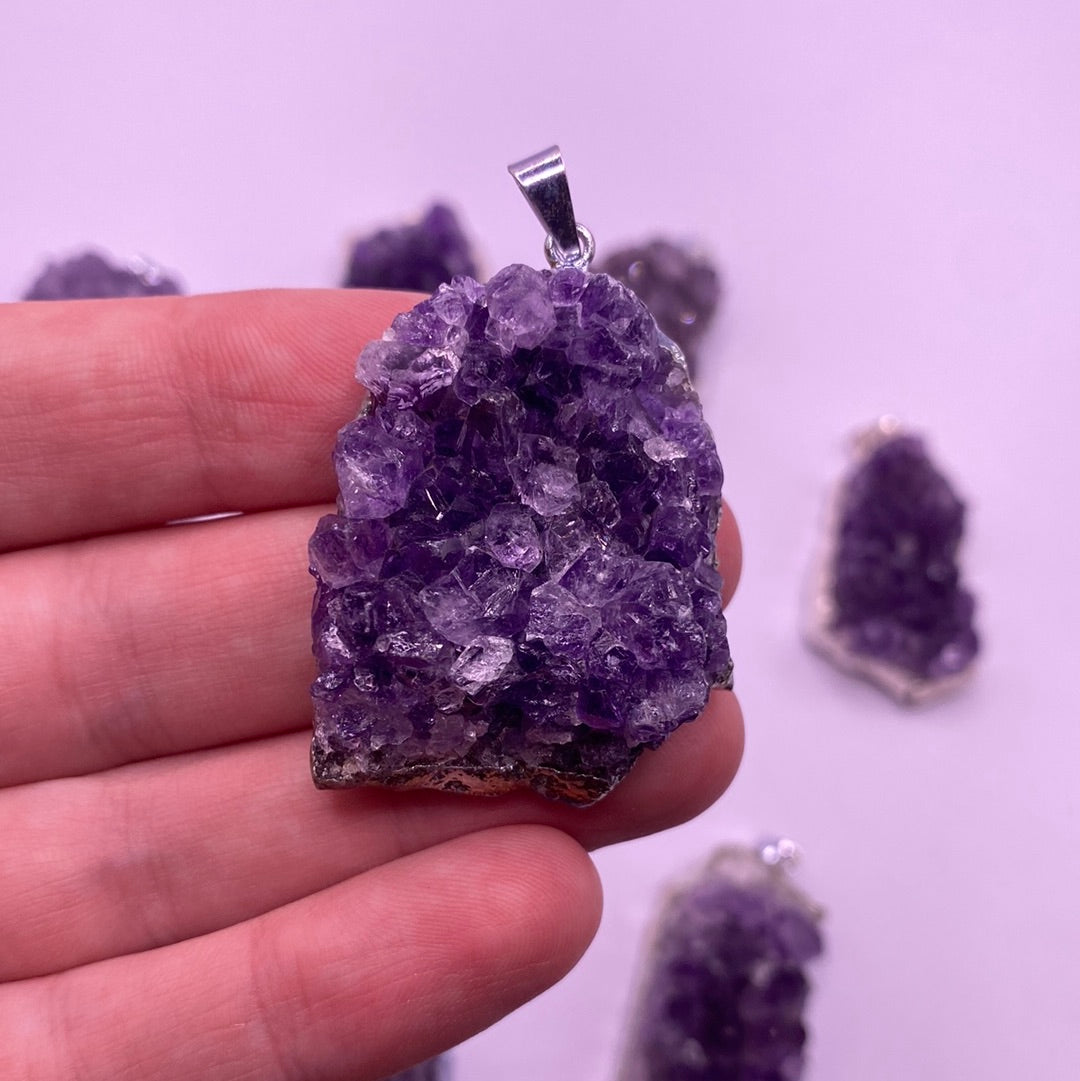 Amethyst Druzy Electroplated Pendant showcasing its vibrant purple hues and unique crystalline texture.