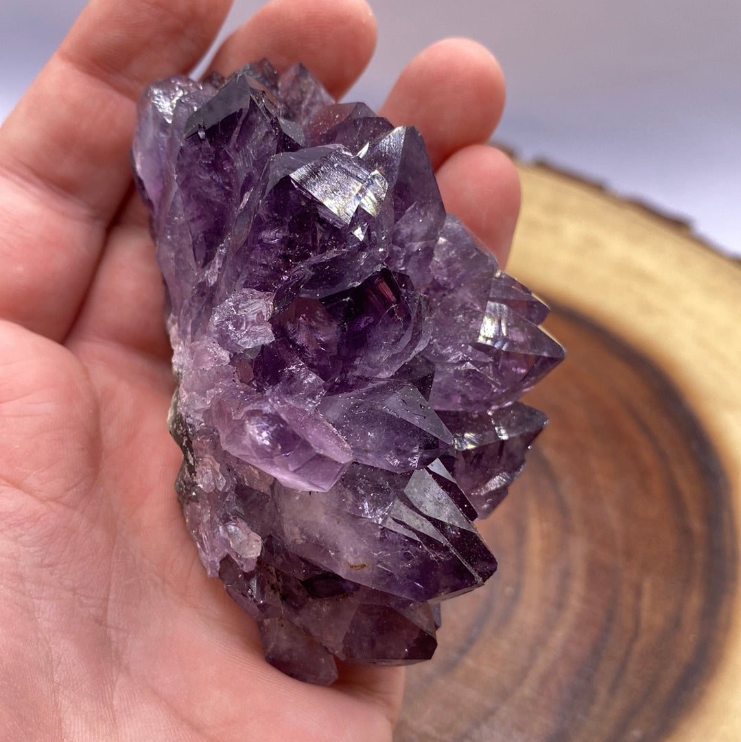 A beautiful Amethyst Druzy crystal cluster showcasing sparkling purple crystals on a rock base, radiating positive energy.