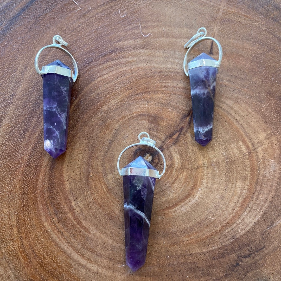 A beautifully handcrafted Amethyst Pendant showcasing a vibrant purple crystal, symbolizing love and positive energy.