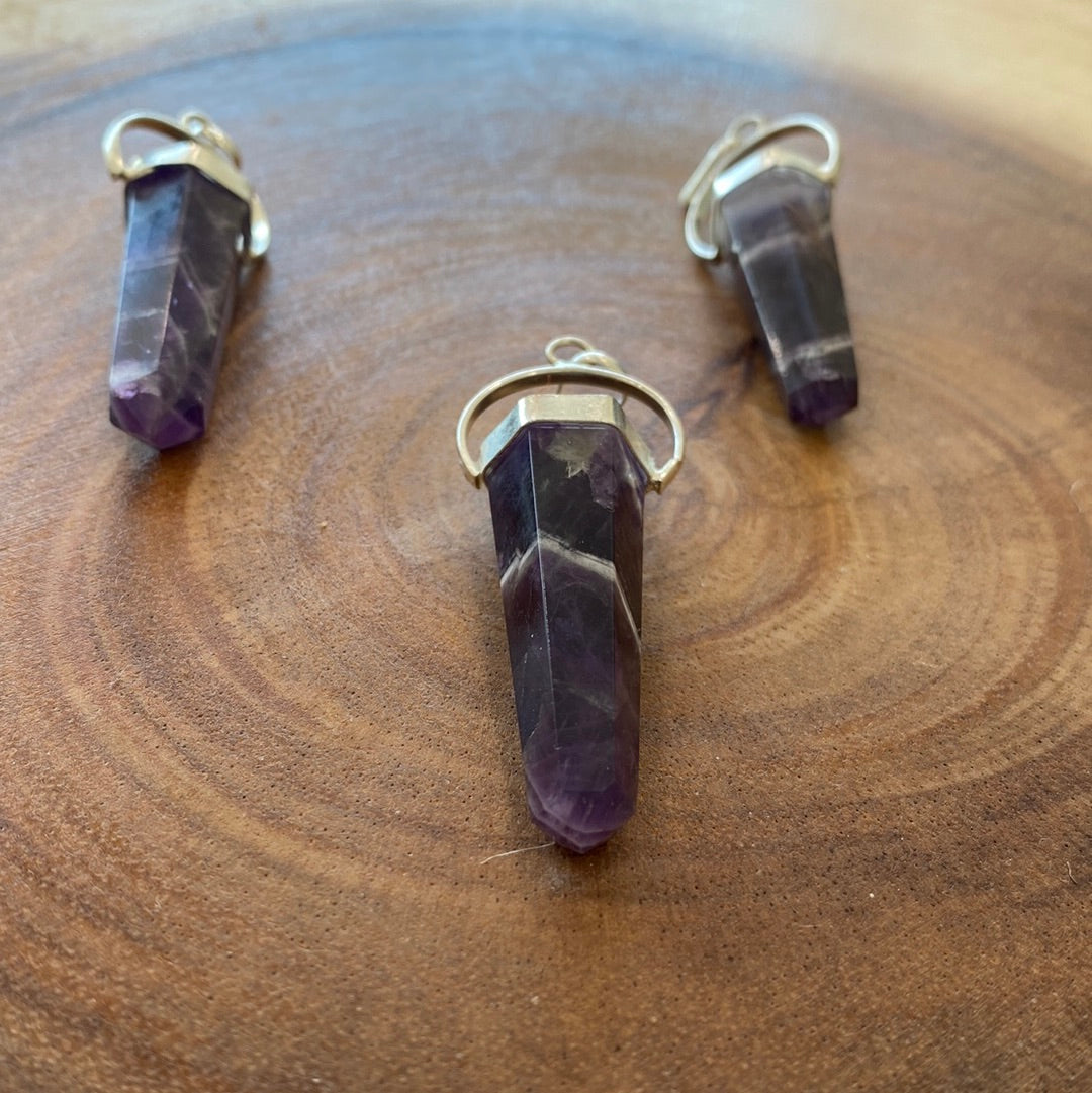 A beautifully handcrafted Amethyst Pendant showcasing a vibrant purple crystal, symbolizing love and positive energy.