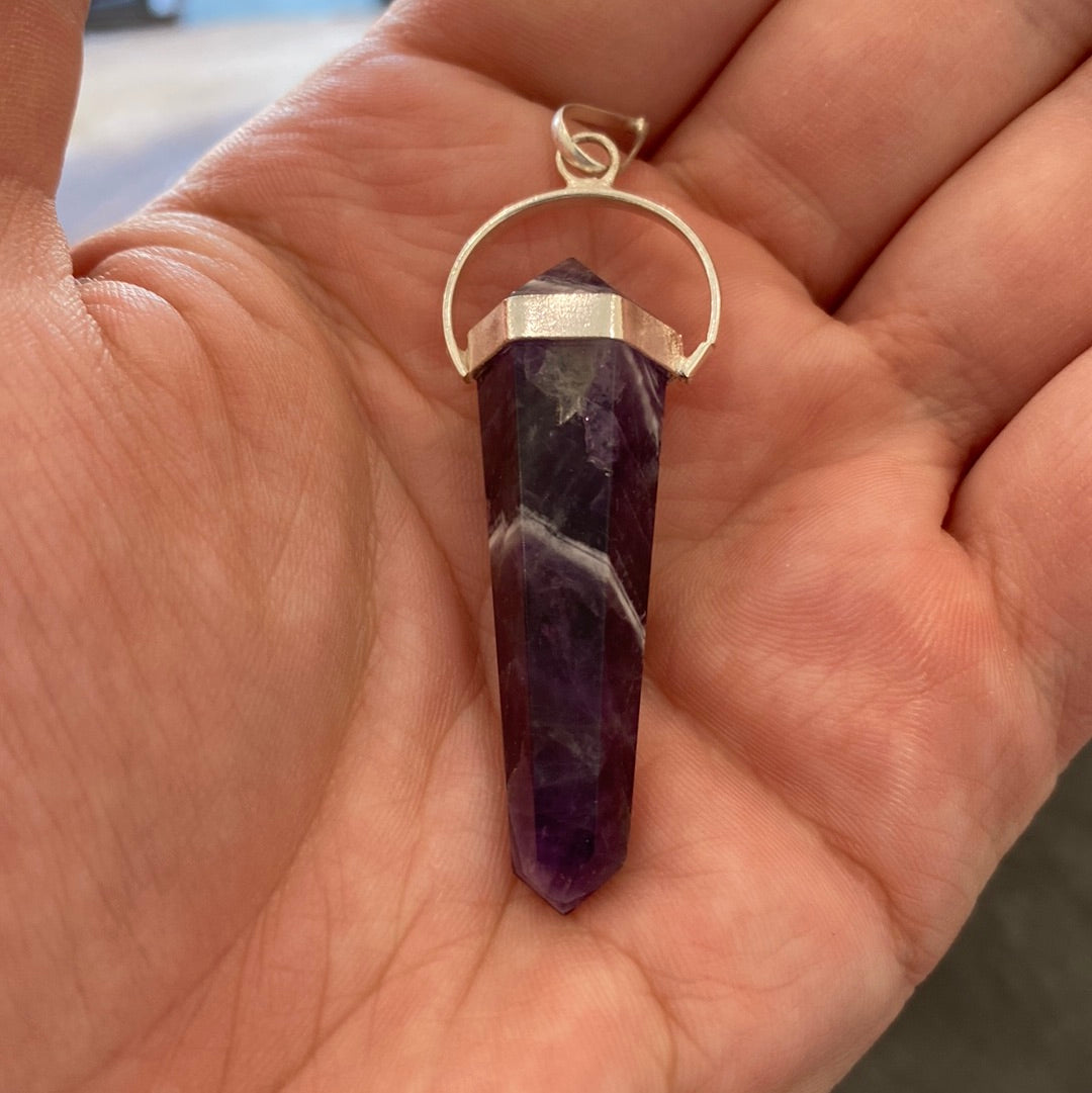 A beautifully handcrafted Amethyst Pendant showcasing a vibrant purple crystal, symbolizing love and positive energy.