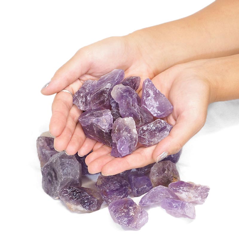 A collection of raw amethyst chunks showcasing their unique purple hues and natural formations.