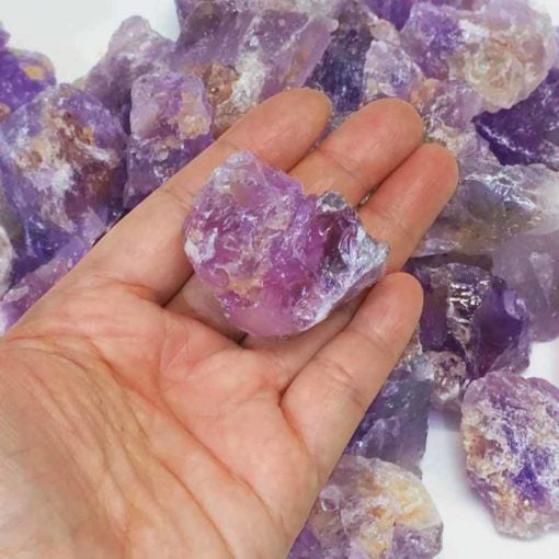 A collection of raw amethyst chunks showcasing their unique purple hues and natural formations.